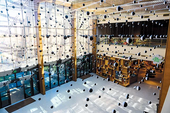“Atom Compass Array” comprising hundreds of magnetic spheres, hangs in the lobby at Science Museum Oklahoma as part of Tom Shannon: Universe in the Mind | Mind in the Universe. - PROVIDED