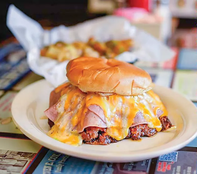 A Buster Burger is a sausage burger topped with ham, chili and cheese. - PROVIDED