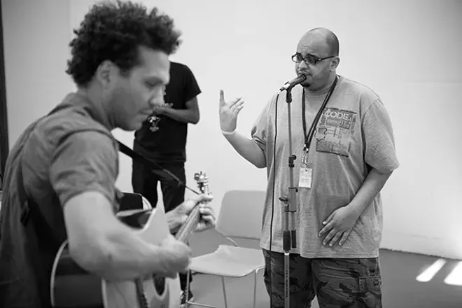 Ahmed Rock on the mic - PHOTO BY PATRICIA LOIS NUSS