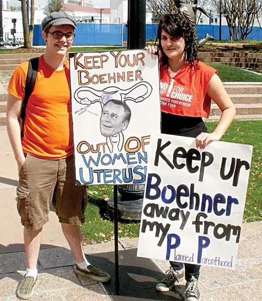 fighting words: Two Orlando protesters send a strong message at a February Planned Parenthood rally against federal cuts to women's health care, but the real battle is closer to home - PHOTO FROM PLANNED PARENTHOOD