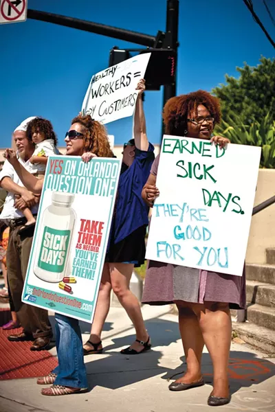 Members of Organize Now and Citizens for a Greater Orange County make some noise June 30 in downtown Orlando. - ROB BARTLETT