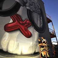 Mark Gmehling’s conversation-starting mural rises above Mills 50