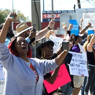 Donald Trump met with boos from protesters as he visits Orlando private school
