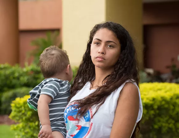 Ariana Colón and her baby evacuated from Puerto Rico. - PHOTO BY MONIVETTE CORDEIRO