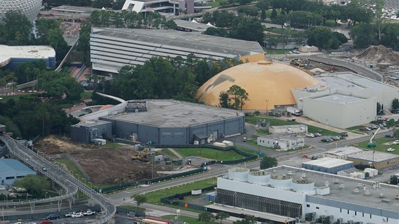 The land clearing for the new space-themed restaurant is now visible. The small, box-like unfinished corporate lounge can be seen in the middle left of the image adjenct to the Mission: Space attraction. - IMAGE VIA BIORECONSTRUCT | TWITTER