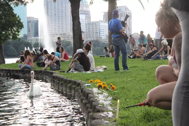 An impromptu vigil Sunday night at Lake Eola. - PHOTO BY CHRIS RODRIGUEZ