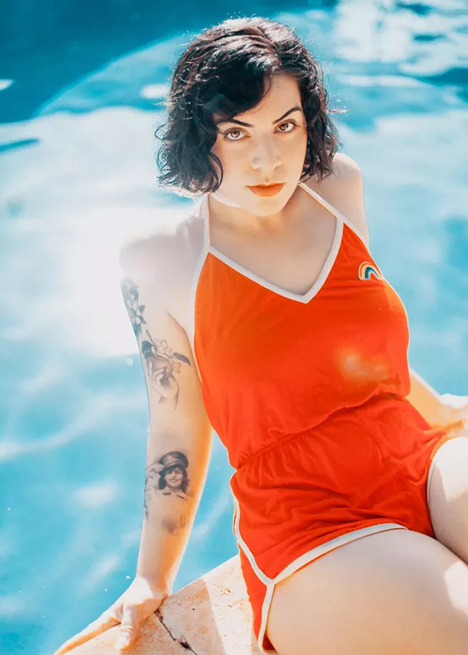 DANI ORMONDE GIVES US LIFE IN A RED ROMPER.PHOTO BY NORREL BLAIR