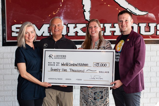 Sara Elliot and John Rivers of 4 Rivers Smokehouse present a check to Erin Gore and Nate Mook from World Central Kitchen for Hurricane Dorian Relief Efforts - PHOTO COURTSEY 4 RIVERS