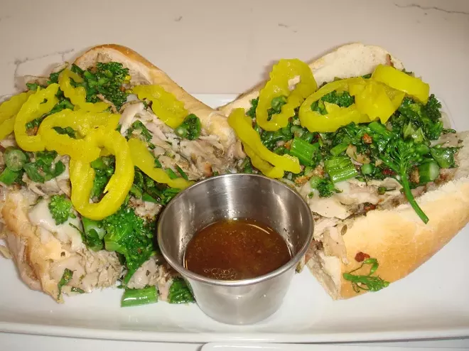 Slow-roasted pork sandwich from Uncommon Catering and Eatery - PHOTO BY LOUIS ROSEN