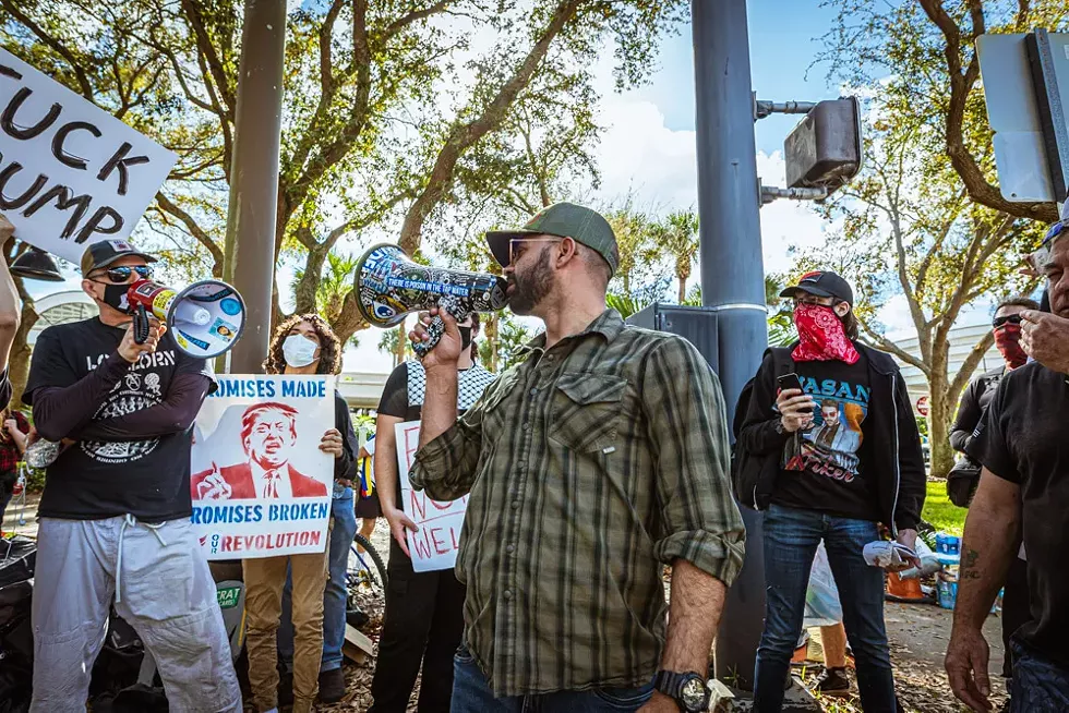 Proud Boy Enrique Tarrio locks (bull)horns with an anti-fascist protester. - PHOTO BY DAVE DECKER