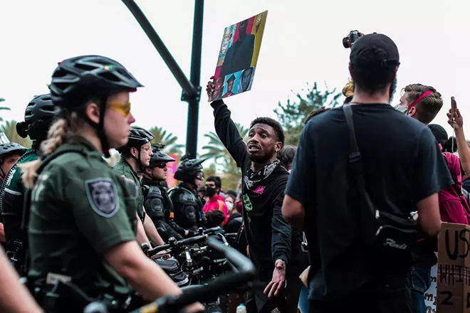 A protester at one of 2020's Black Lives Matters marches in downtown Orlando. - PHOTO BY KAYLA SMITH