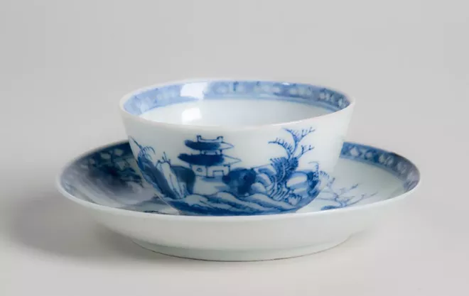 Unknown maker, Chinese, the "Nanking Cargo" from the Geldermalsen (a cargo ship with the Dutch East India Trading Company), Riverscape pattern, tea bowl and saucer, 2 in. (5 cm) in height, porcelain, gift of Dr. Benjamin L. Abberger Jr. and Nancy Hardy Abberger Collection, c. 1752. - COURTESY OF THE CHARLES HOSMER MORSE MUSEUM OF AMERICAN ART, WINTER PARK, FL.
