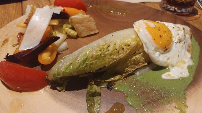 Grilled romaine, fried egg, chimichurri with a salad of roasted beets, stone fruit, manchego, cast-iron croutons