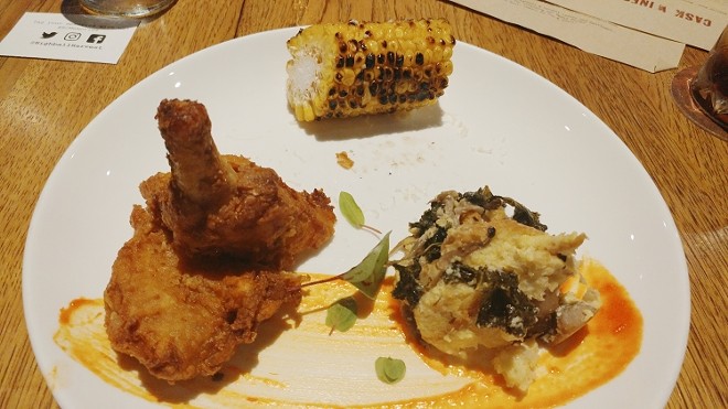 Triple-dipped fried chicken, charred corn, savory mushroom-kale bread pudding, golden hot sauce