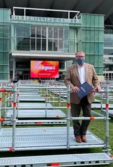 Mayor Dyer tries out a Frontyard Festival seating pod