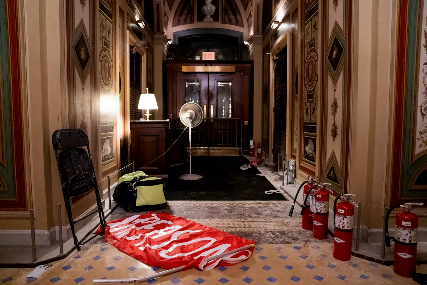 A discarded flag reading "Treason" lays on the floor inside the U.S. Capitol, Washington, D.C., U.S., Jan. 6, 2021. - PHOTO BY ALEX GAKOS