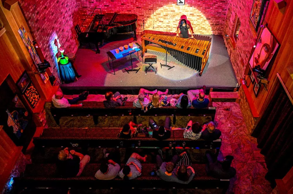Bird's-eye view from the top balcony of percussionist Britton-René Collins playing Timucua's 1,000th show - PHOTO BY JIM LEATHERMAN