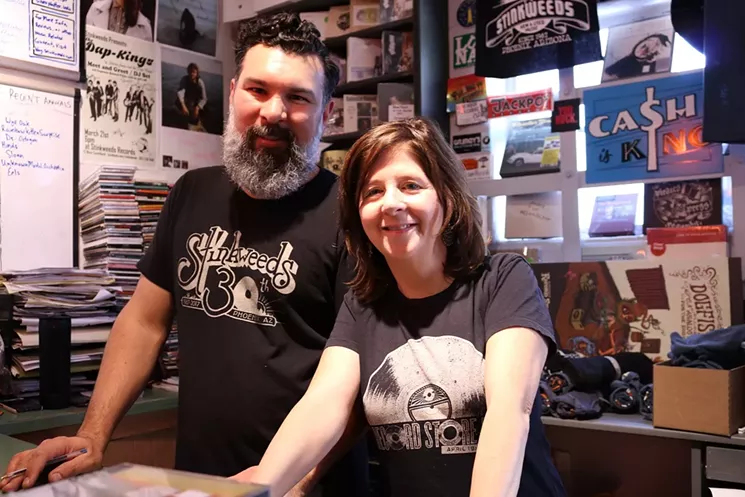 Dario Miranda (left) and Kimber Lanning enjoying a pre-pandemic Record Store Day at Stinkweeds. - MICHELLE SASONOV