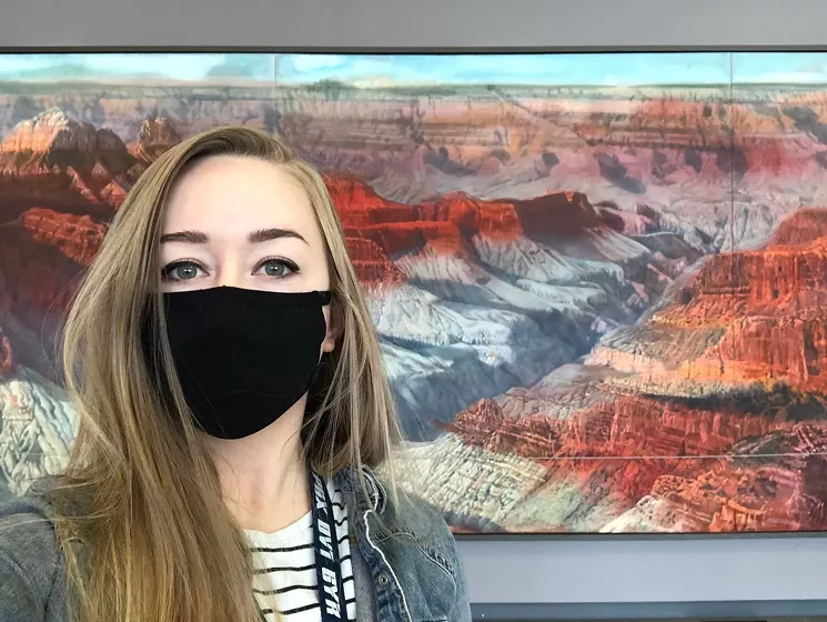 Haley Hinds took this selfie with Merrill Mahaffey's Grand Canyon landscape in Terminal 3. - HALEY HINDS