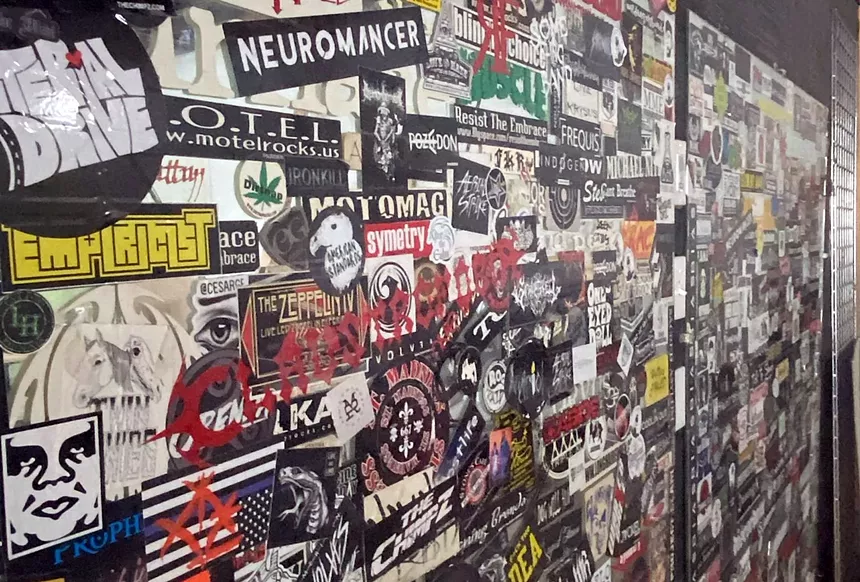 Poster-covered mirrors are by Joe's Grotto inside the Furious Brewing Company. - Steve Goodman