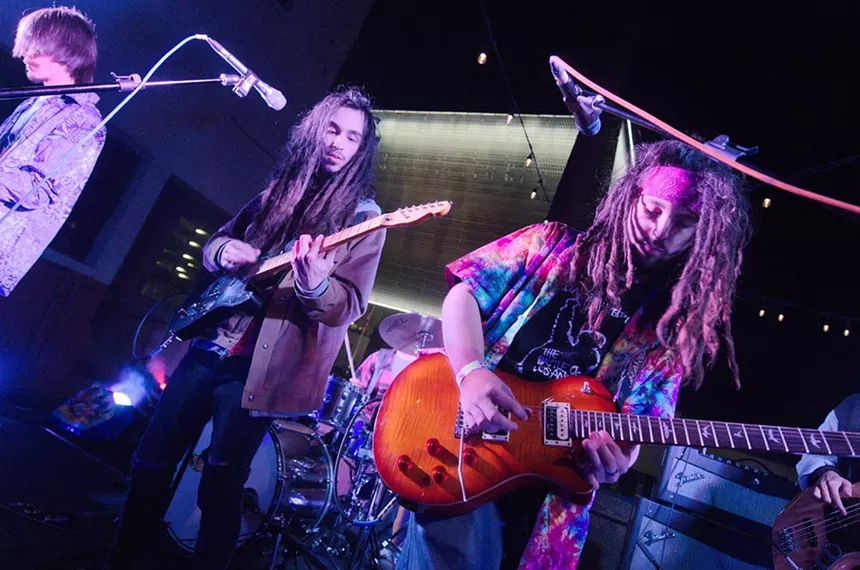 Local musicians performing outside of The Pressroom's original location in downtown Phoenix. - BENJAMIN LEATHERMAN