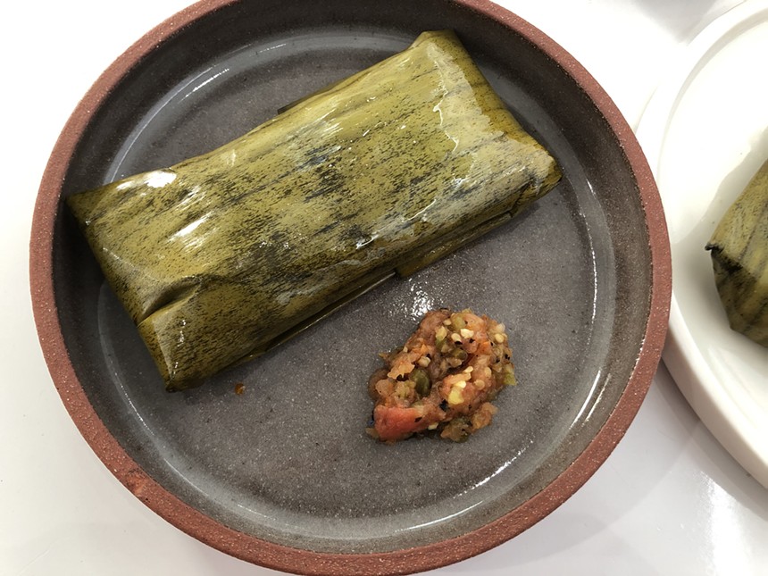 A chile Colorado tamale made from nixtamalized heirloom blue corn. - CHRIS MALLOY