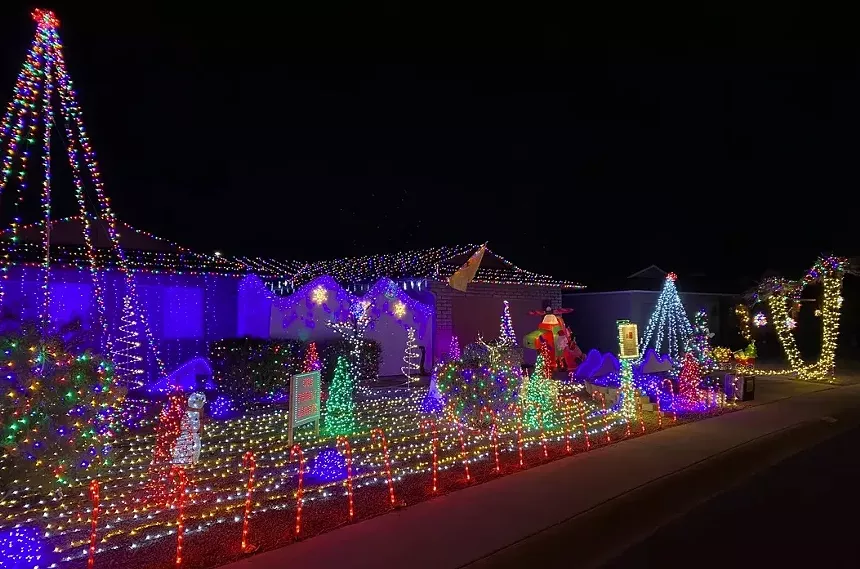 Local teen Brolin Cox is behind his family's Scottsdale display. - COX FAMILY