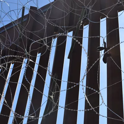 A tall border fence has long separated Nogales, Arizona, from Nogales, Mexico.