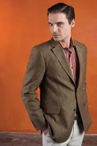 Brian wears: caramel un-constructed, two-button linen jacket by CG, "woven stripe" print sport shirt by Etro, and sisal stretch cotton/linen flat-front trousers by Hiltl; all available at Larrimor's. - HEATHER MULL