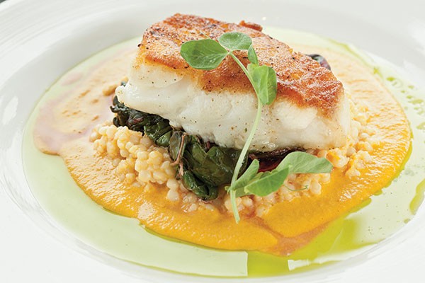 Chilean sea bass with saffron-lobster couscous, Swiss chard and carrot-ginger emulsion - PHOTO BY HEATHER MULL