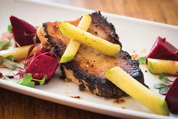 Crispy pork belly with caramelized apples, pickled beets, whole-grain mustard and apple-cider gastrique