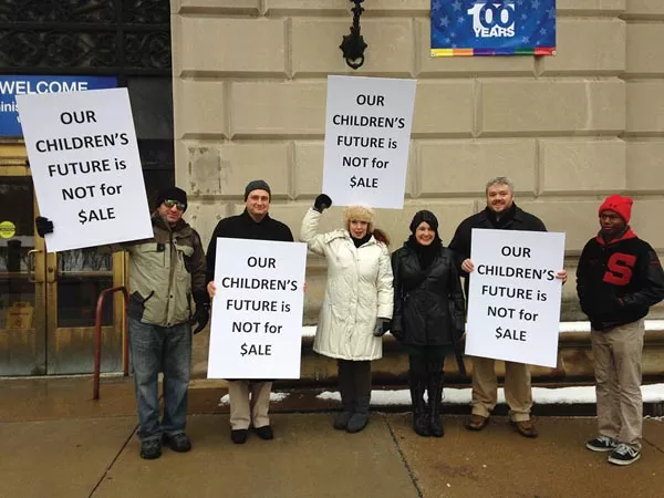 Edward Alexei (second from left), Liz Berlin (fourth from left) and David Tinker (fifth from left) protest with other Schenley alumni last week. - PHOTO COURTESY OF PITTSBURGH URBAN MEDIA