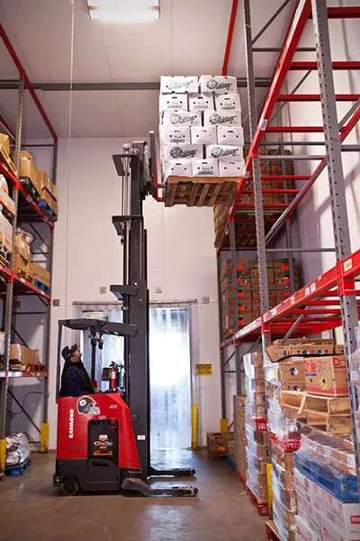 Forklift full of cabbages at food bank