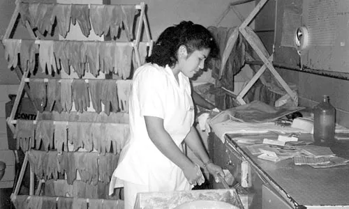 In many developing countries, shortages require health-care workers to wash exam gloves for reuse. - PHOTO: COURTESY OF GLOBAL LINKS