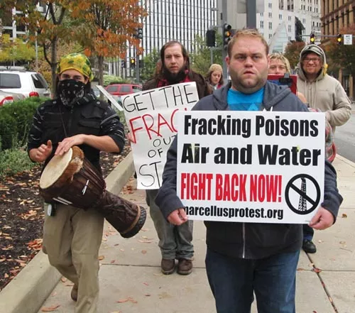 In the hole: Not all protests have drawn much support. An Oct. 26 march against natural-gas drilling attracted only a dozen protesters to the David L. Lawrence Convention Center. - PHOTO BY CHRIS YOUNG