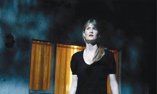 It's all set: Nikki Grace (Laura Dern) gets disoriented on a dimly lit movie soundstage in Inland Empire.