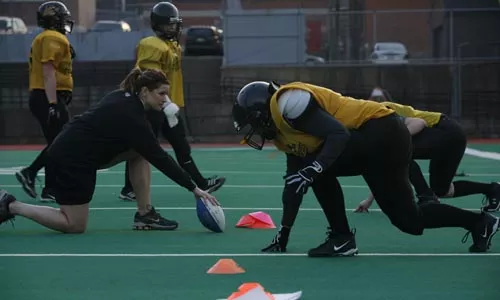 Jennifer Gold runs a practice drill for the defense. - HEATHER MULL