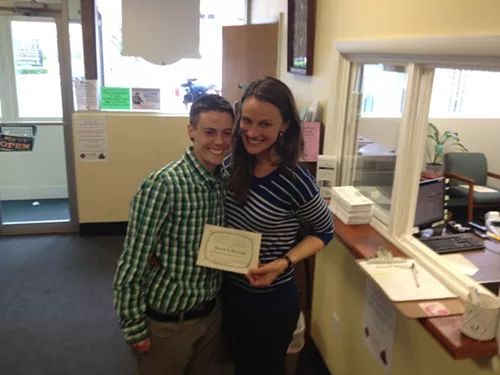 Jess Garrity, left, and Pamela VanHaitsma with their marriage license