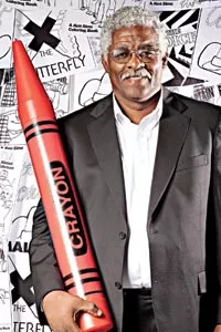 Kenny Sims is trying to use the coloring books he created to help children. - BRIAN KALDORF
