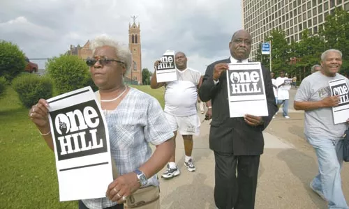 Members of One Hill marched from Freedom Corner to the Mellon Arena on June 4 to make sure the community benefits from the construction of a new Penguins Arena. - PHOTO BY HEATHER MULL