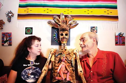 Mexico Lindo owners Lisa Digioia-Nutini and Jean-Pierre Nutini with wooden deer dancer from Guerrero. - PHOTO BY HEATHER MULL