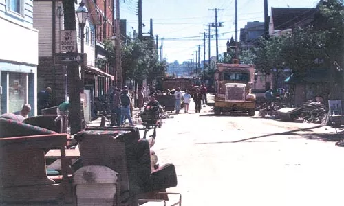 Neighbors scrap flood-damaged property, in 2004. - PHOTO PROVIDED BY FRED BOHN JR.