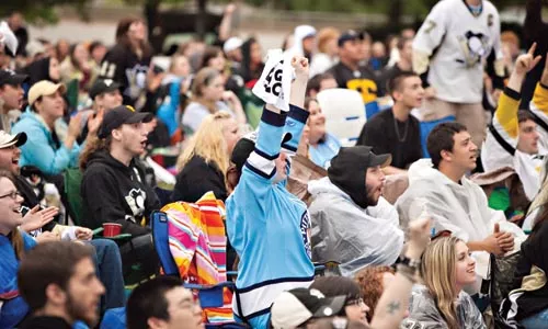 Penguins fans watch on the edge of their seats as the Penguins battle the Hurricanes in game 4 of the Stanley Cup playoffs. - BRIAN KALDORF