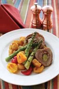 Penn's Corner stuffed pork loin, with asparagus and gnocchi - HEATHER MULL