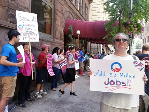 Protesters outside the Duquesne Club Downtown Monday.