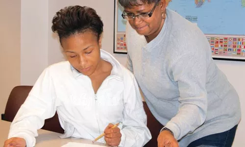 Shequaila Griffin (left) and Diane Bunch are benefiting from adult-literacy classes. But the program faces large budget cuts. - CHRIS YOUNG