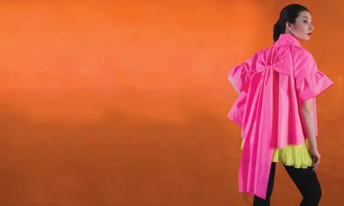 Siran wears: hot-pink nylon jacket by Jocelyn, yellow silk tank, by LaRok, and stretch trousers by Theory; all available at Chick Downtown. - HEATHER MULL