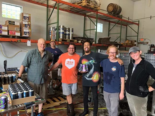 Jonny Goood (middle) with one of Full Pint's owners Barrett Goddard (orange shirt) and a few members of the Full Pint Brewery team - PHOTO: MONTANA EFAW