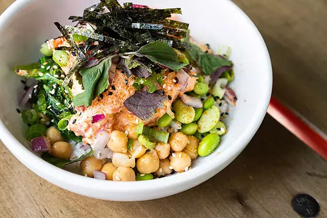 Spicy Tuna Poke Bowl: Edamame, roe, seaweed salad, cucumber, onions, - toasted sesame, soy, sriracha, sriracha mayo, - wasabi, cilantro, shiso, nori, shallot chips, - togarashi - PHOTO: TAYLOR BLOCKSOM