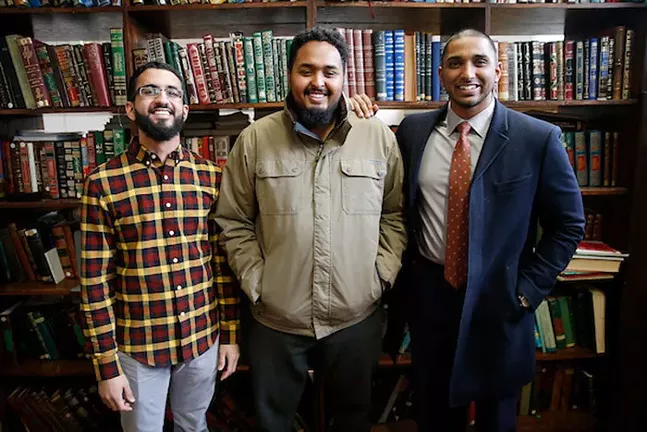 Wasi Mohamed, Executive Director of the Islamic Center of Pittsburgh (right), poses for a portrait with his staff members Mohamed Sajjad (left) and Koshin Yusuf (center) at the Islamic Center of Pittsburgh - CP PHOTO: JARED WICKERHAM